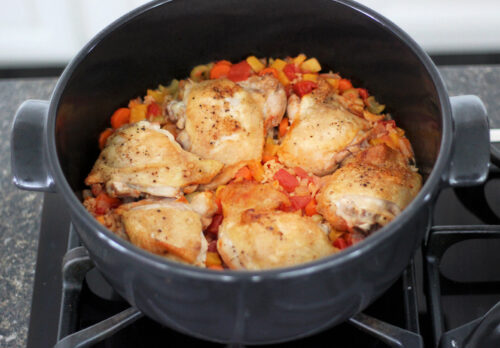 Cooked arroz con pollo in a Dutch oven