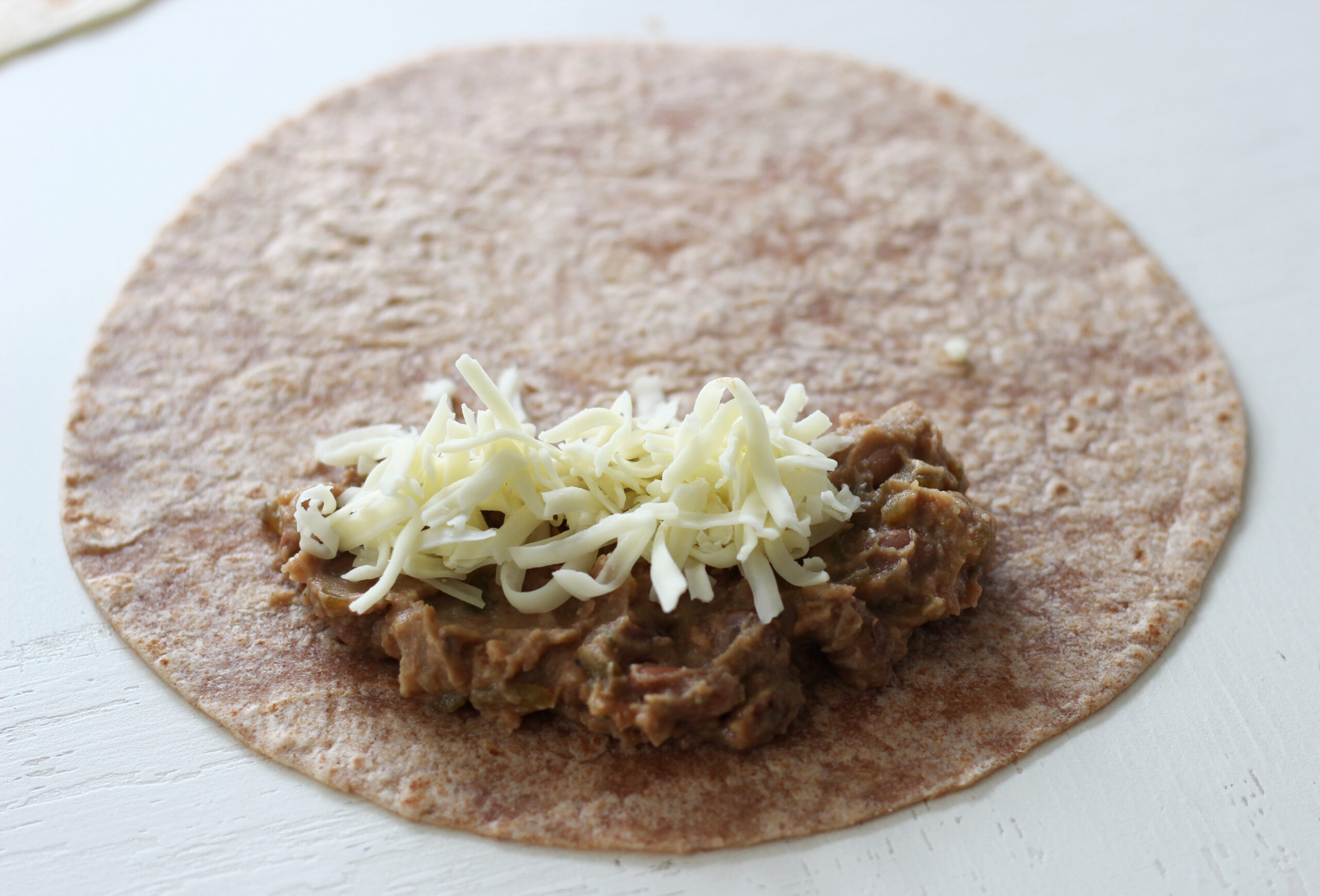 Bean burrito before being rolled up