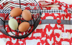 eggs in a basket on top of apron
