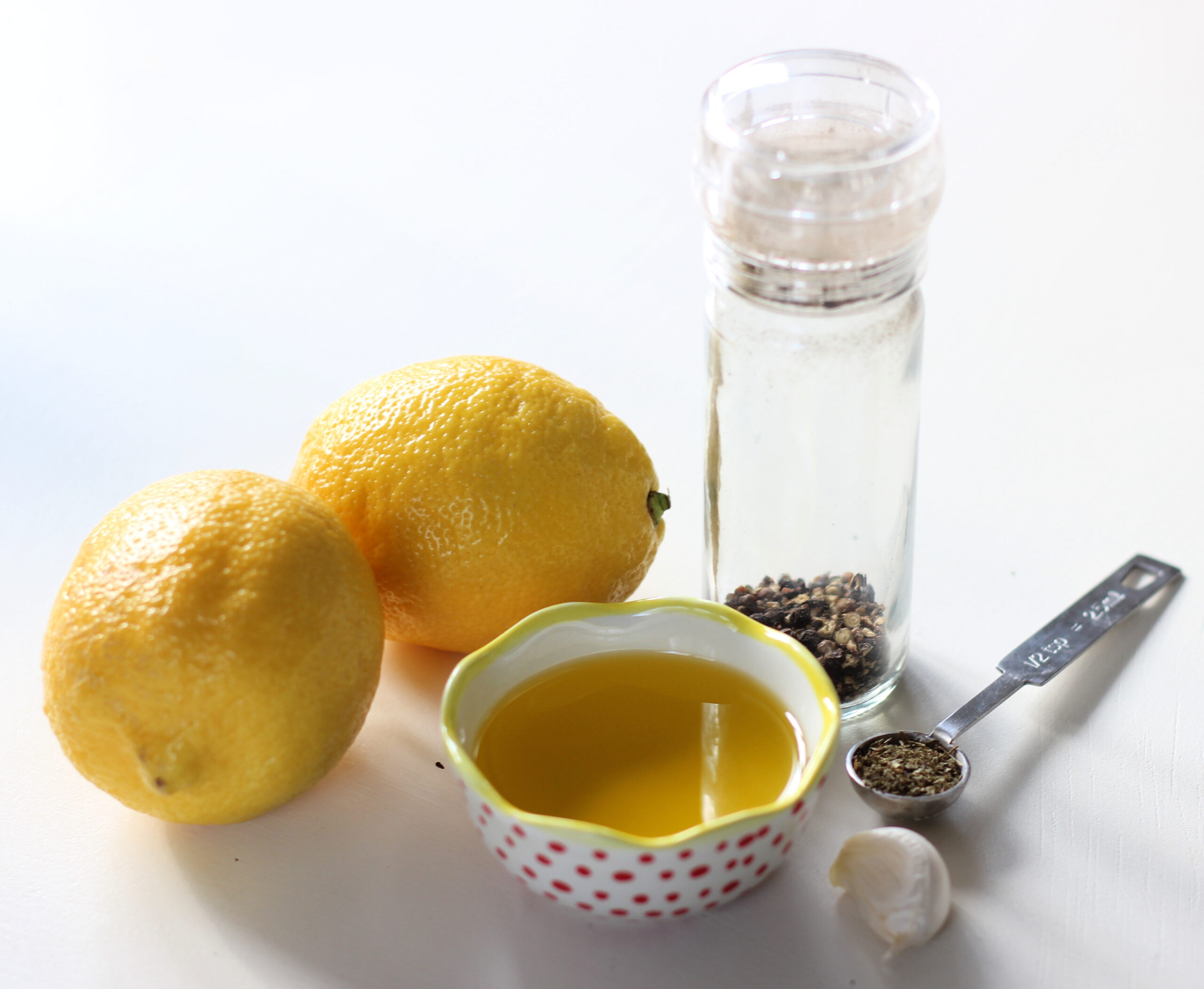 Ingredients needed to make lemon garlic salad dressing