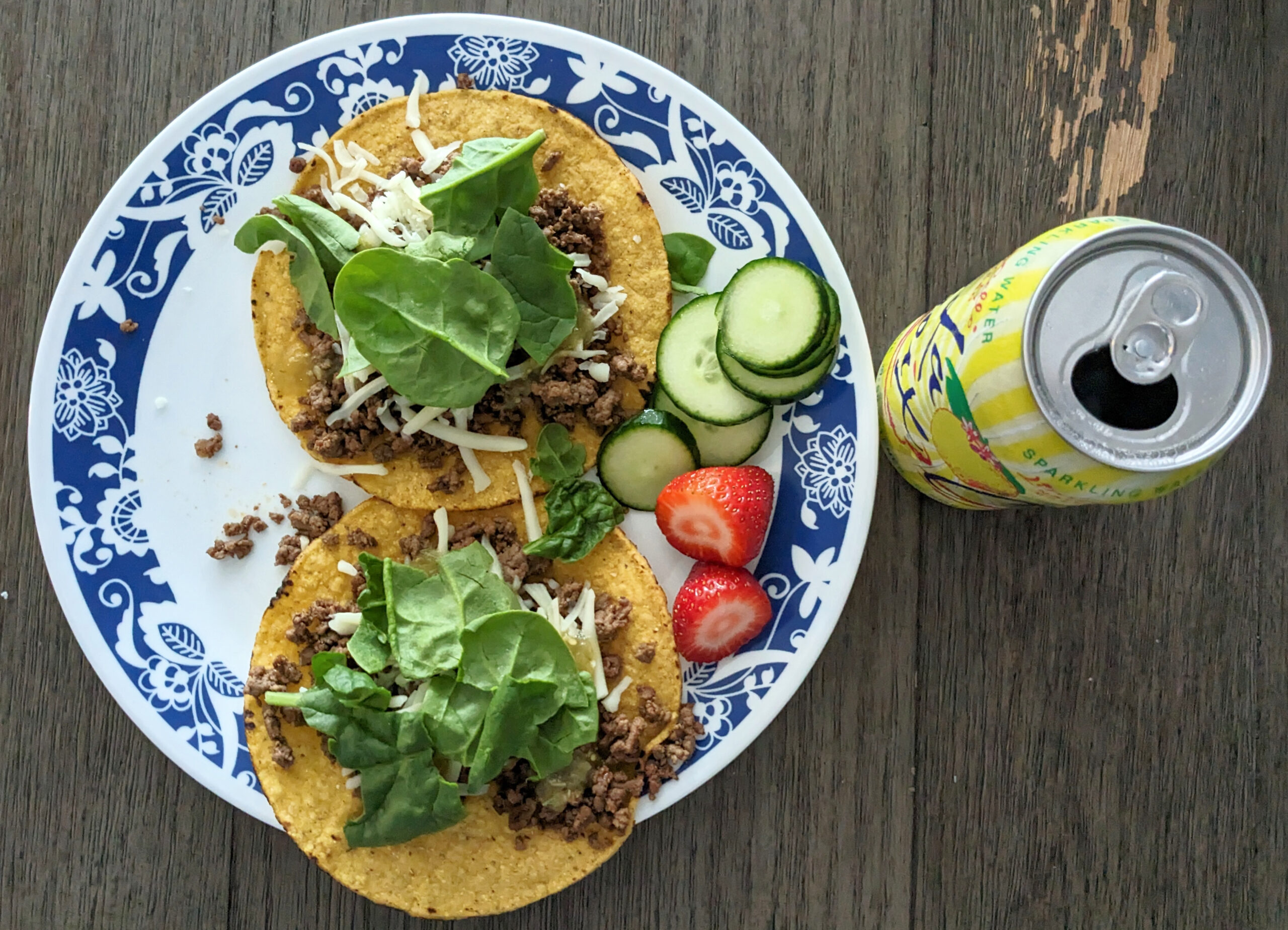 Dinner tostadas with cucumber and strawberries on the side