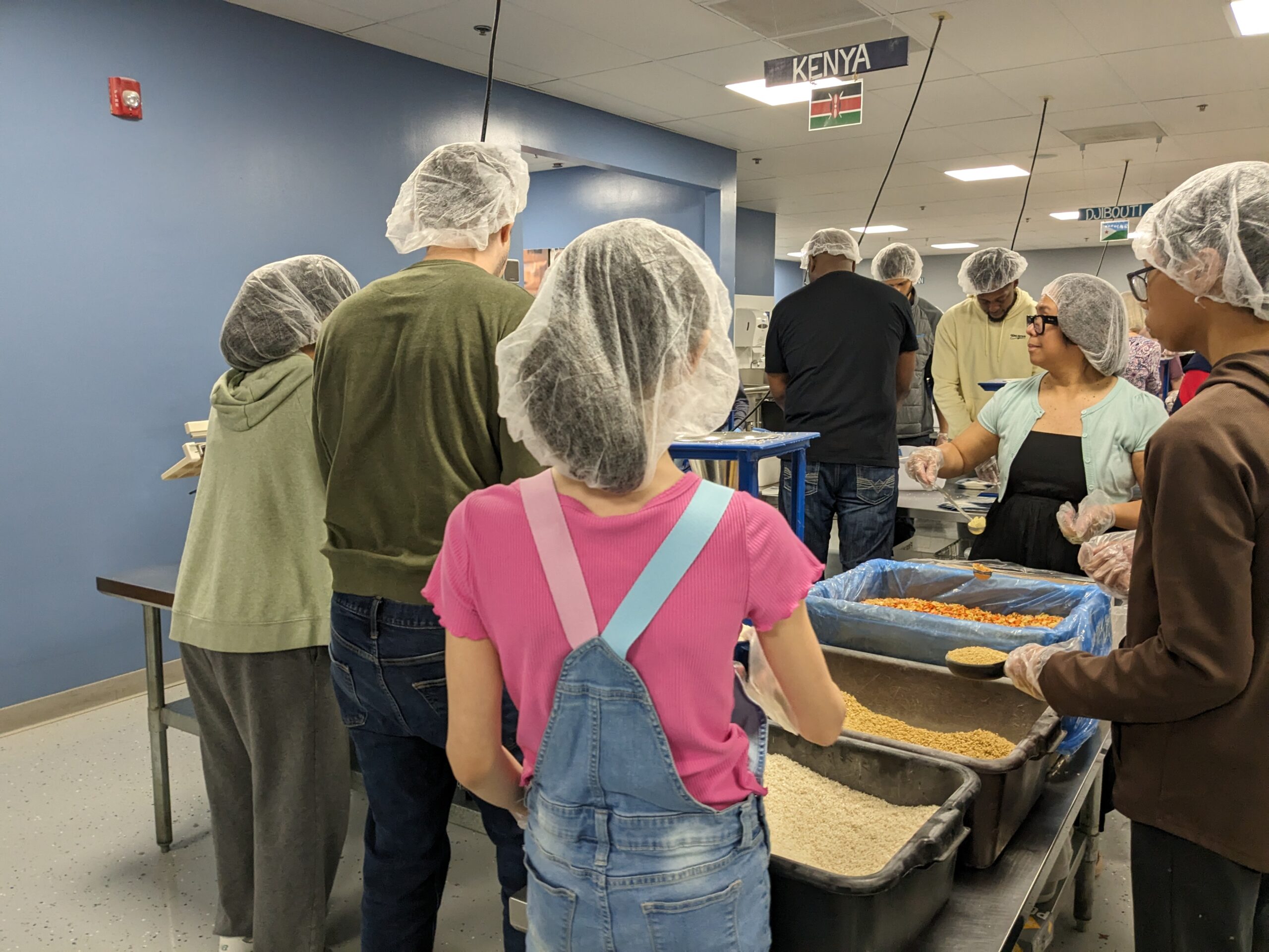 People packing food at Feed My Starving Children