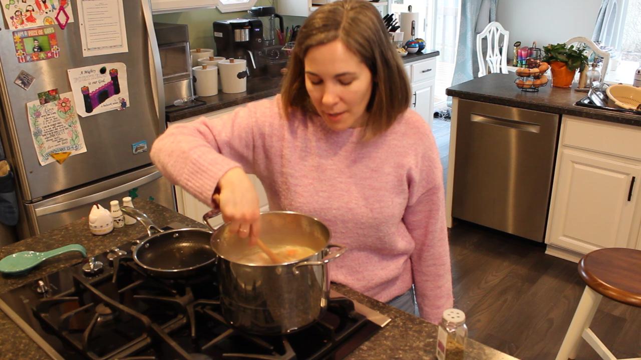 Kristyn cooking vegetable chicken soup
